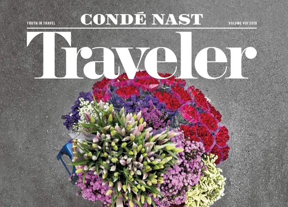 Cover: CONDÉ NAST Traveler magazine with a bouquet of flowers