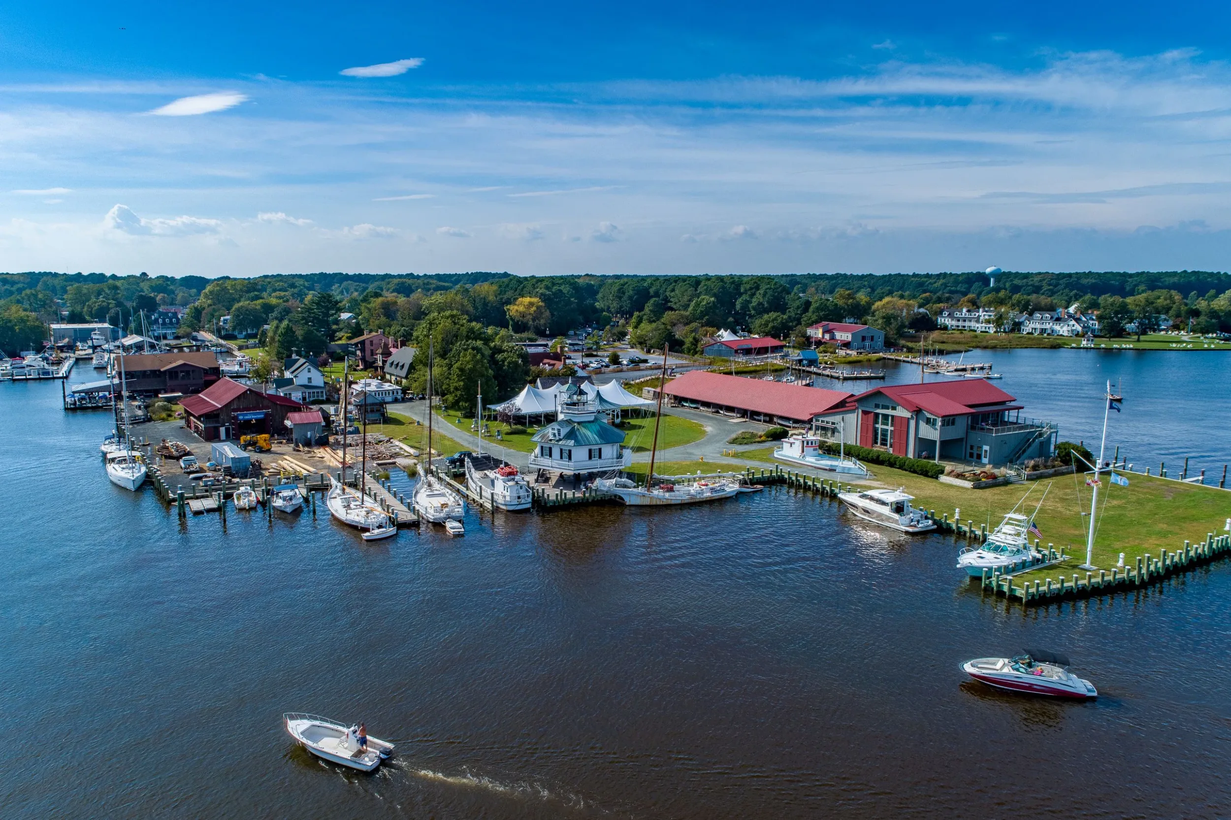 Aerial view of a waterfront town with docks, boats and a marina