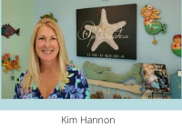 Kim Hannon, smiling woman in a colorful top in front of a starfish sign