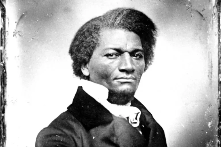 Sepia portrait of Frederick Douglass in a dark coat and high collar