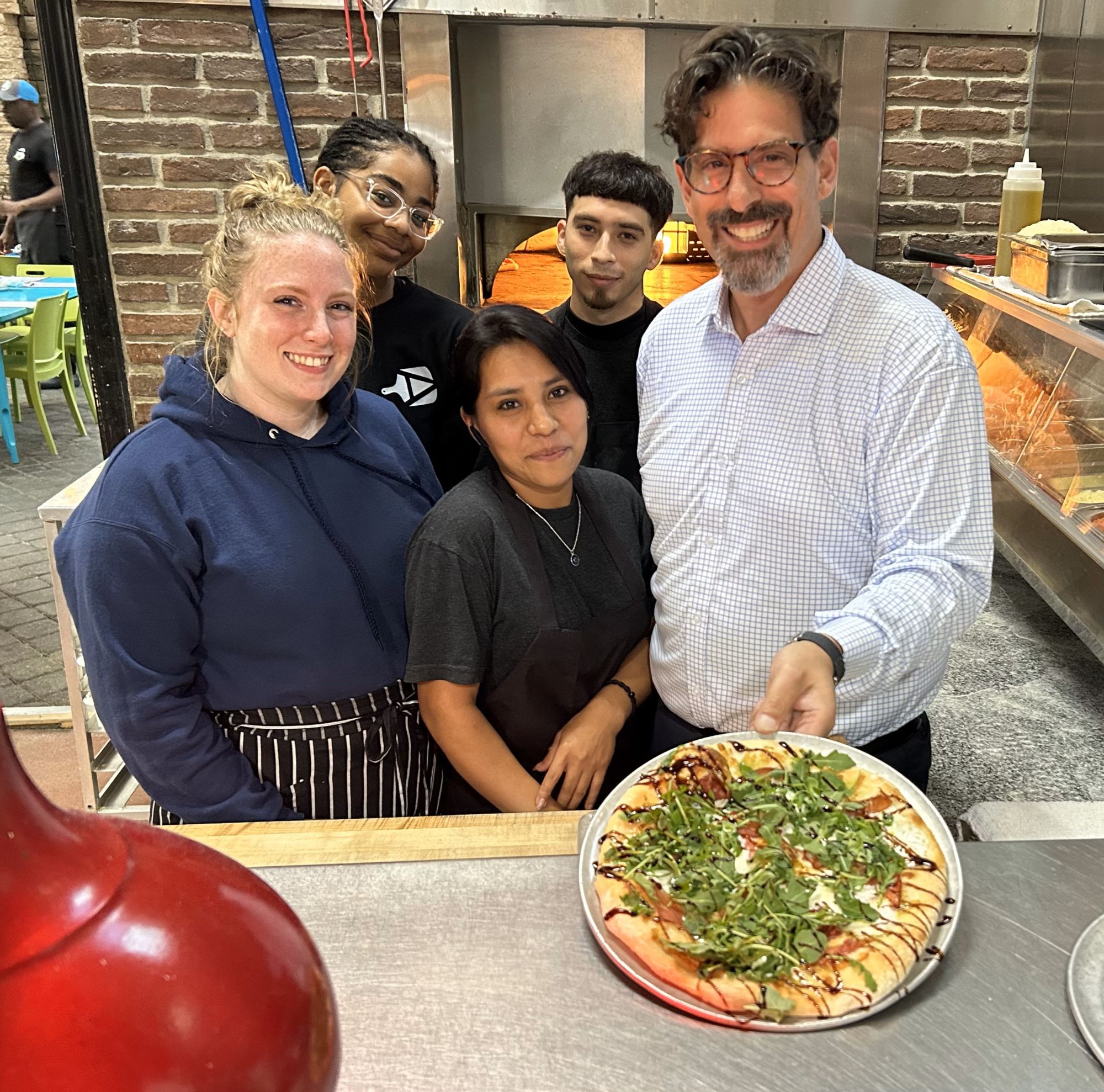 Ava’s Pizzeria & Wine Bar staff in St. Michaels gather in honor of the restaurant’s 15th anniversary, with the Chef’s Favorite pizza, shown, offered at a special price this October of $10.19 in recognition of the day the restaurant opened. Pictured from the left are Danella Gilligan, Makia Morton, Celina Perez Garcia, Edwin Martinez, and Chris Agharabi. Reservations and more are at www.avaspizzeria.com.