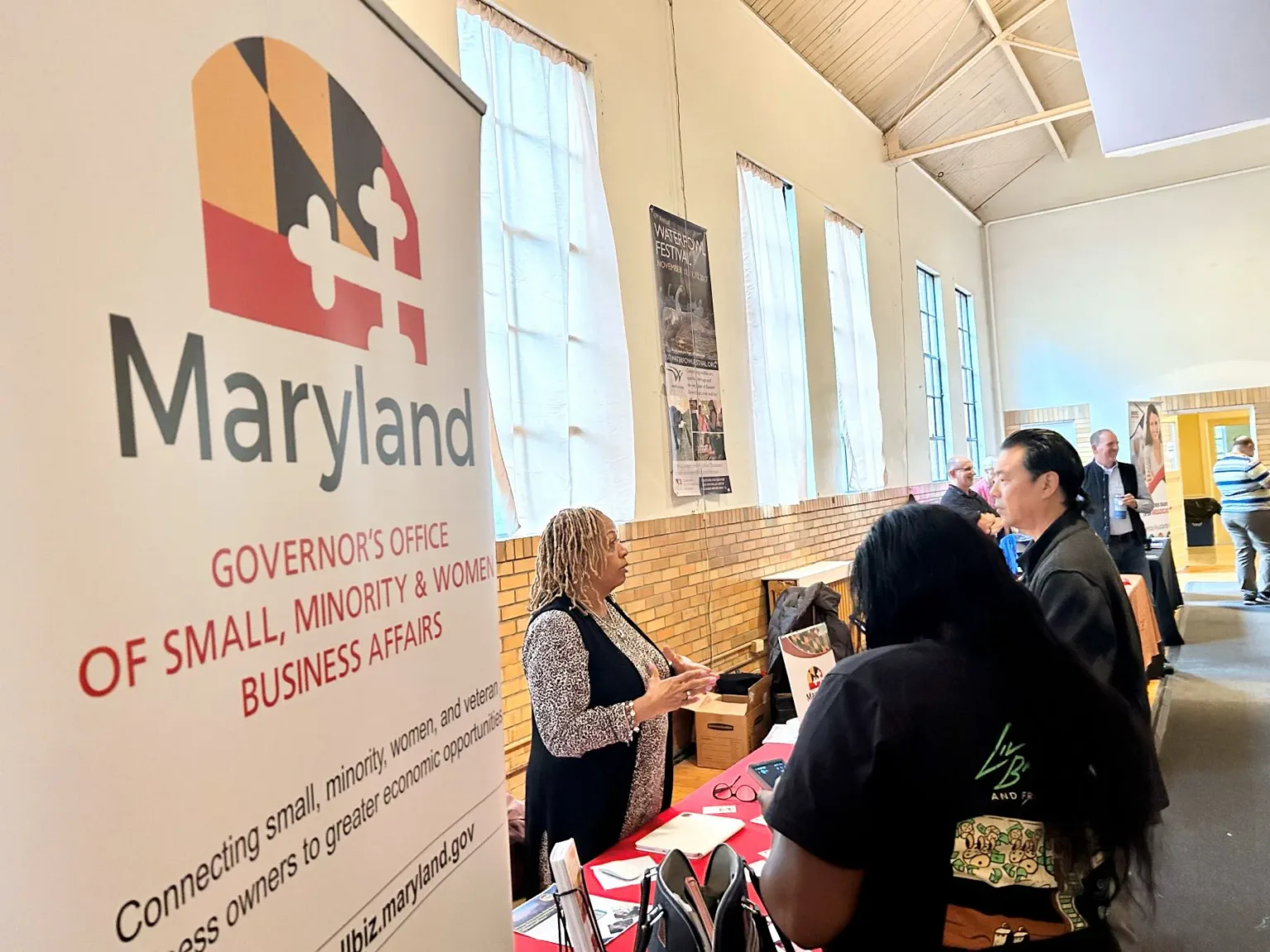 Maryland Governor's Office of Small, Minority & Women Business Affairs banner beside a booth with attendees
