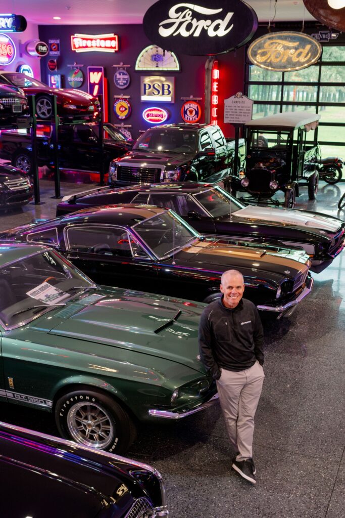 Dave Wilson in his car garage, vertical