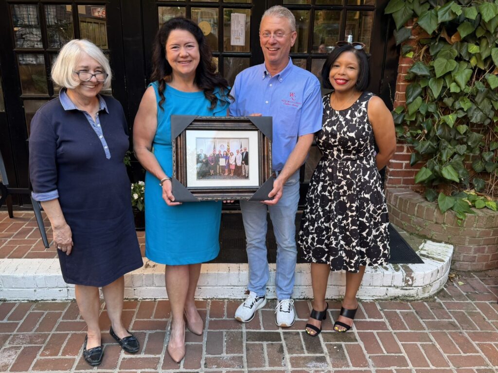 Cassandra with a gift from the Talbot County Council, with Chuck Callahan and Keasha Haythe