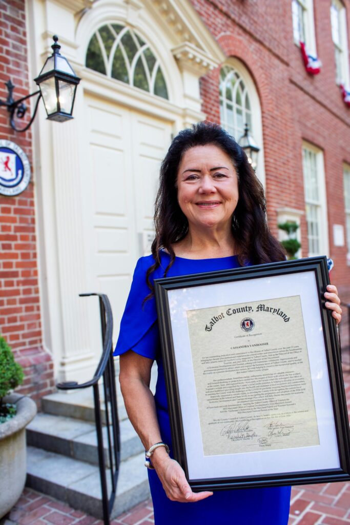 Cassandra Vanhooser stands with proclamation