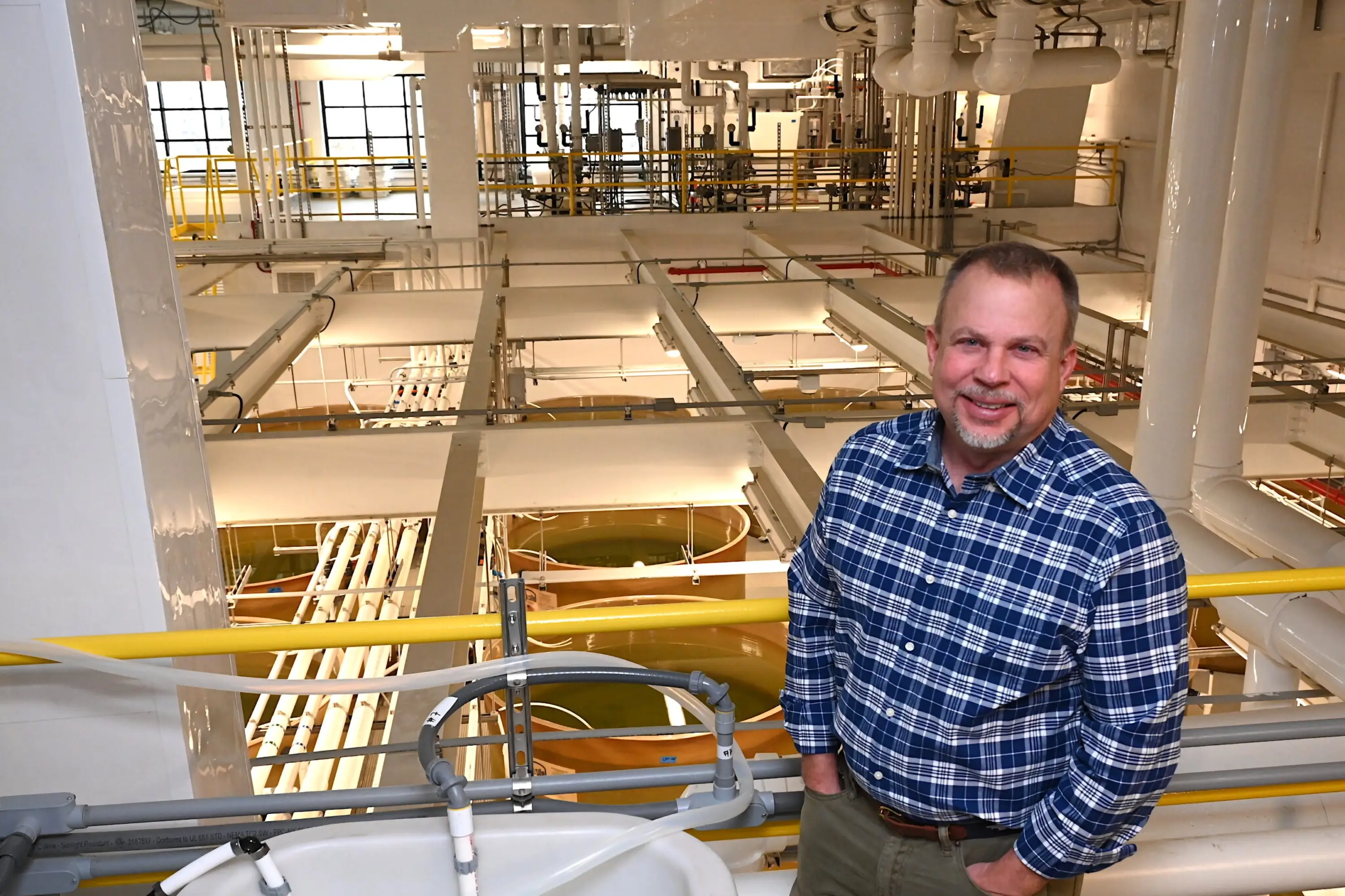 Stephan Abel stands overlooking Ferry Cove’s oyster hatchery facilities