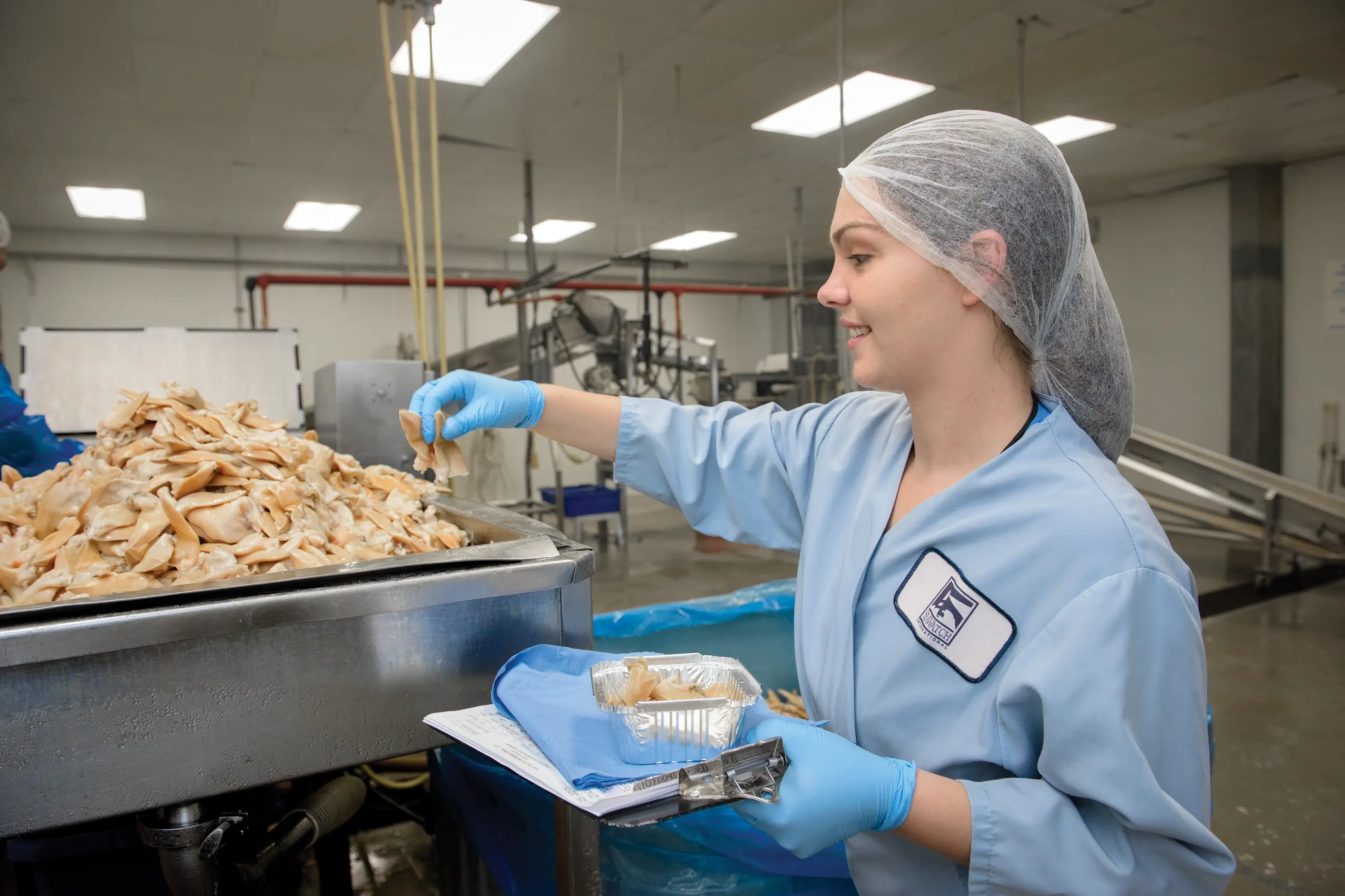 A woman working for SeaWatch handling meat