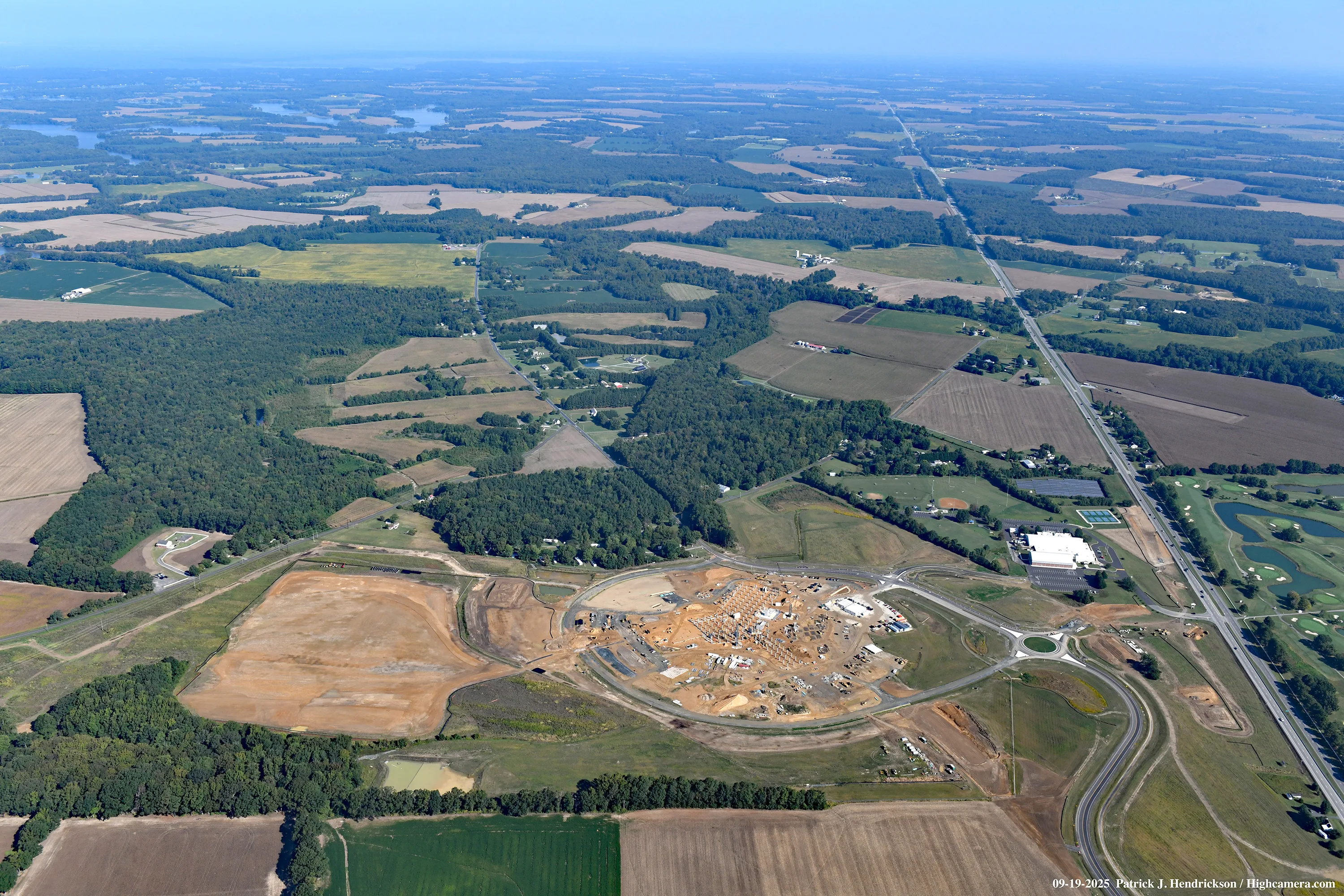 Aerial view of UM Shore Regional Medical Center under construction, with farmland